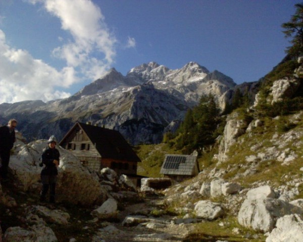 Slovenia's highest mountain Triglav in the back and Vodnikov dom (Vodnik's mountain hut) i