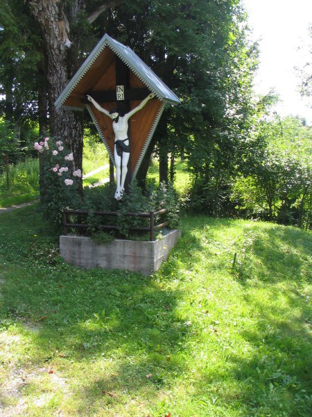 Crucifix in front of the house